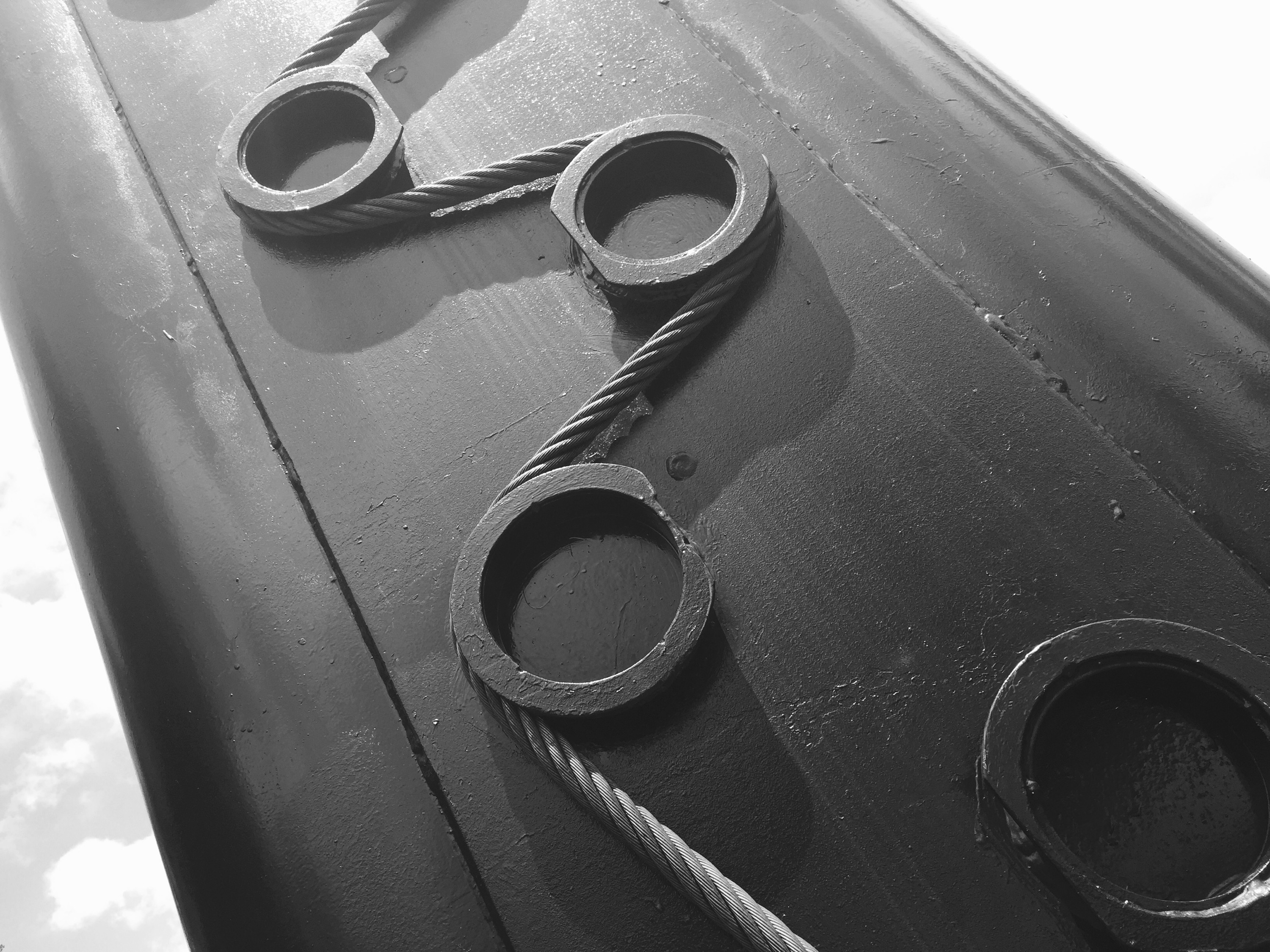 a black and white photograph of industrial bolts and cable on the Gatlinburg Skylift